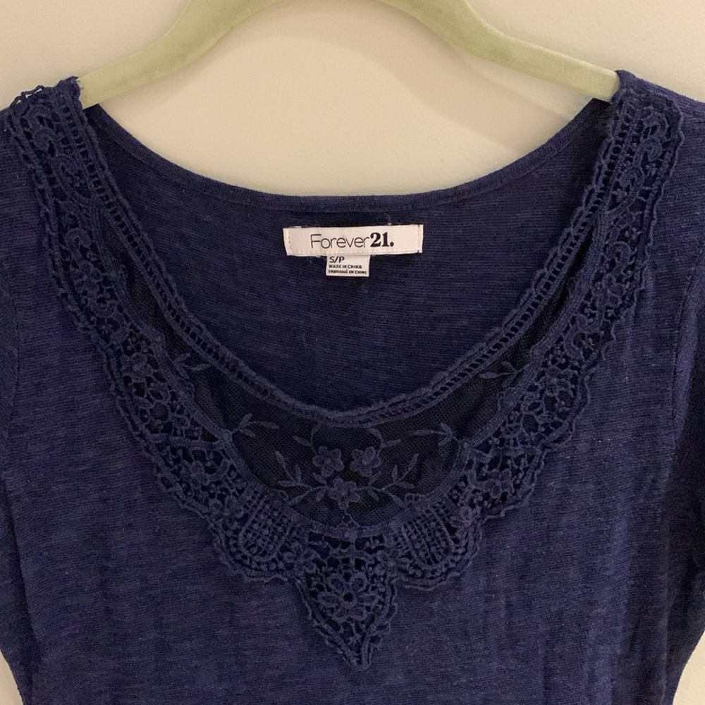 Forever 21 navy blue short sleeved dress with lace trim on the chest. Size small